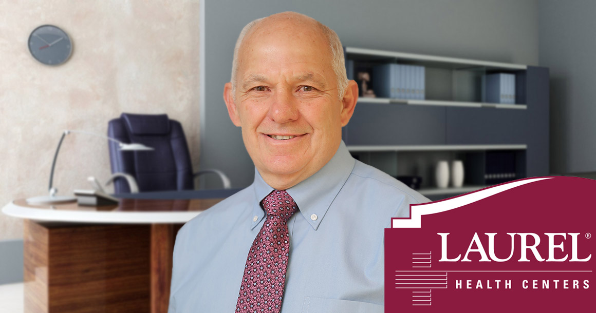 Laurel Behavioral Health Psychologist Gerald Jerry Cerrone standing in front of a welcoming office