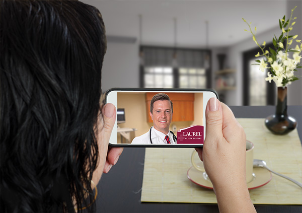 Female patient conducts online visit with Laurel Health doctor