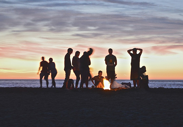 Young people gathered at beach party