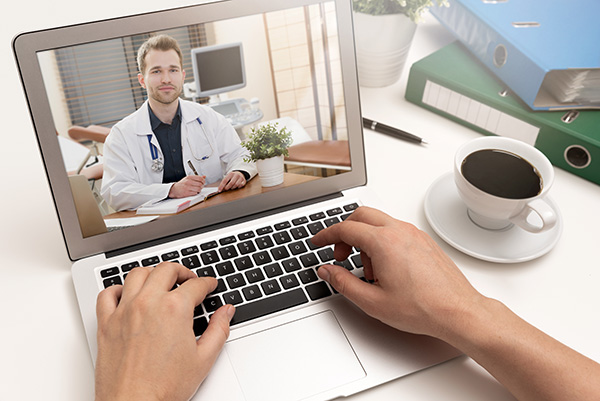 Telemedicine visit with a doctor using a laptop