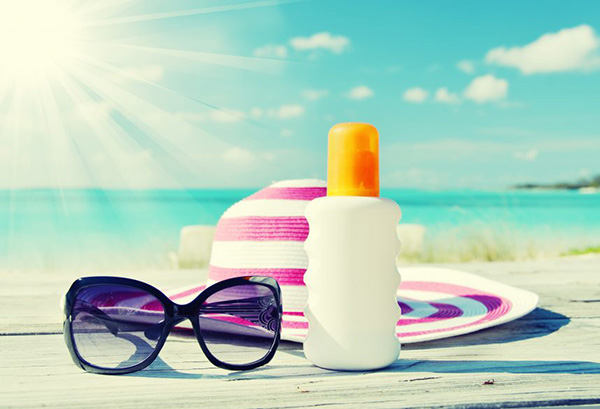 Stay safe in the sun with sunscreen, a hat & sunglasses