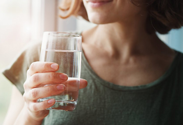 Woman drinking a glass of water