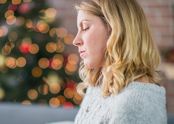 Woman feeling depressed and down about the holidays