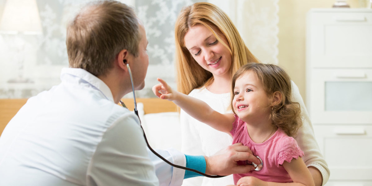 Pediatrician Conducting Wellness Visit Physical with Mother & Child