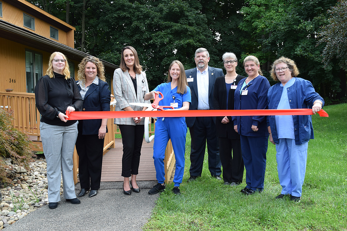 Laurel Health Staff Cut Celebratory Ribbon in front of Laurel Dental - Towanda Dental Clinic During Grand Opening Event