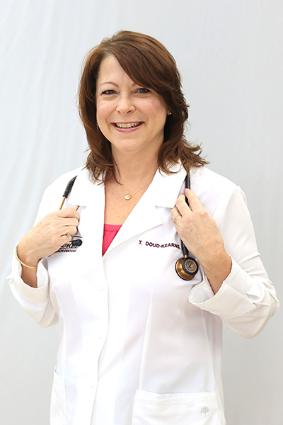 Photo of Tina Doud-Kearns in a White Coat with a Stethoscope; Tina is a Certified Registered Nurse Practitioner at the Blossburg Laurel Health Center