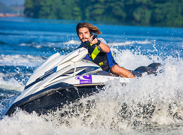 Man Riding a Jetski While Wearing a Life Vest After Being Trained