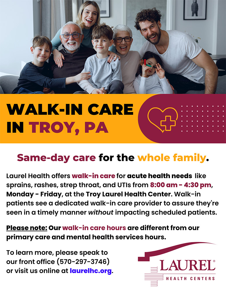Multi-generational family comprised of parents, grandparents, and children smiling and sharing information about Troy Laurel Health Center's new walk-in care service, offered Monday through Friday from 8 am to 4:30 pm