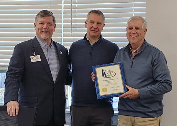 Laurel Health President James A. Nobles and PACHC Director Eric Kiehl present Dennis J. Murray with his 2023 Apex Award for Excellence in Board Service
