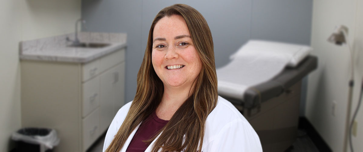 Photo of Alison Hallinan, FNP-C, in an exam room; Alison is a certified registered family nurse practitioner practicing at Wellsboro Laurel Health Center, located at 7 Water St. in Wellsboro, PA