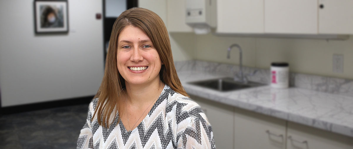 Photo of Tanika Cushing, PA-C, standing in an exam room; Tanika is a certified physician assistant practicing at the Elkland Laurel Health Center in Tioga County, PA.