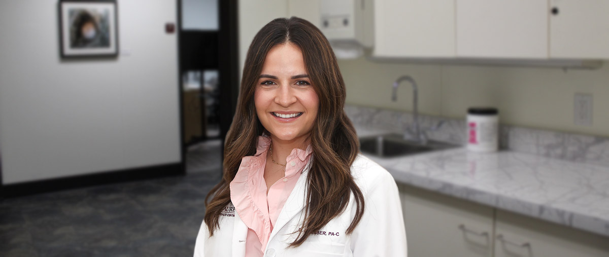 Photo of board-certified physician assistant Deb Dresser, PA-C, standing in a Laurel Health clinic; Deb provides acute care to patients of all ages through our walk-in care program at the Wellsboro Laurel Health Center in Wellsboro, PA.